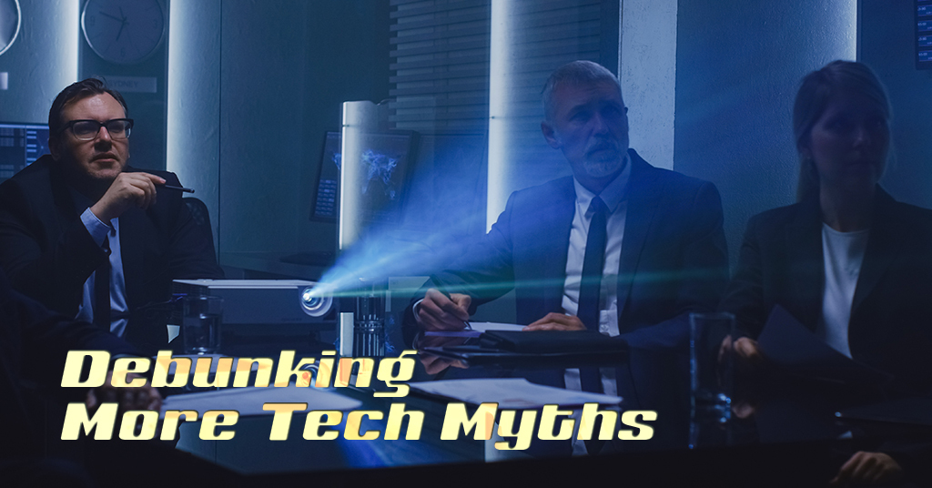 Debunking Tech Myths Part Two - A group of business people watching a projector